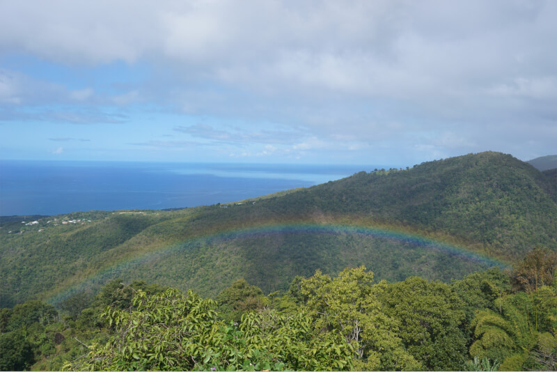 View in Guadeloupe, rainbow, sea and mountains